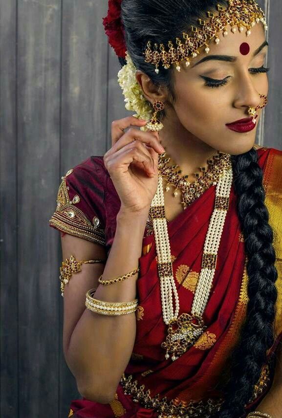 Bharatanatyam dancer in complete traditional attire showing costume details