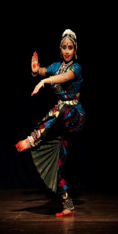 Classical Bharatanatyam dancer in traditional pose showcasing grace and technique