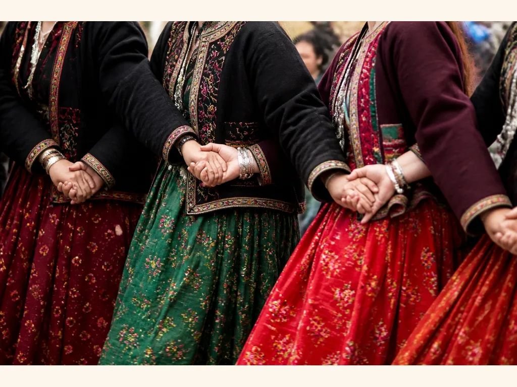 Artistes in traditional Himachali attire at a folk dance performance — representative image