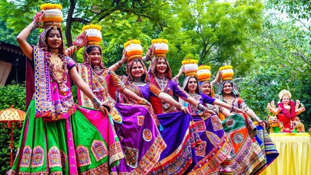 Garba dance group performing a coordinated routine at a Navratri event