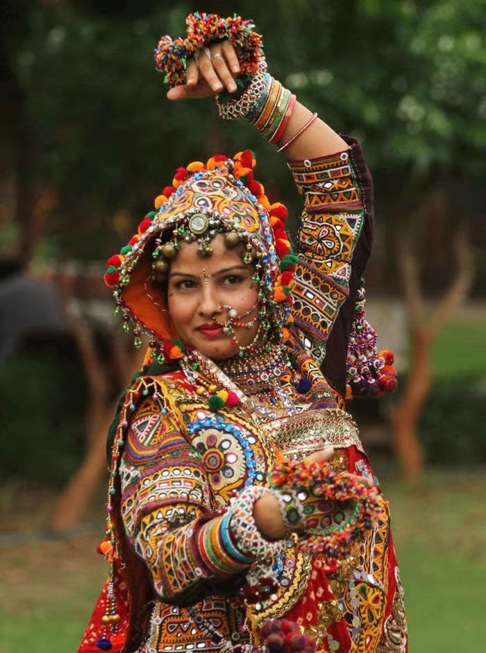 Professional Garba dancer in a traditional chaniya choli performing at a Navratri celebration