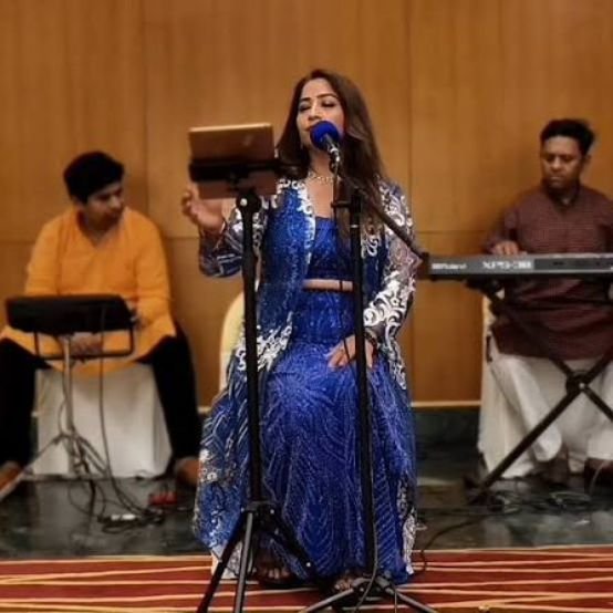 Chhattisgarhi singer performing live at a corporate cultural evening